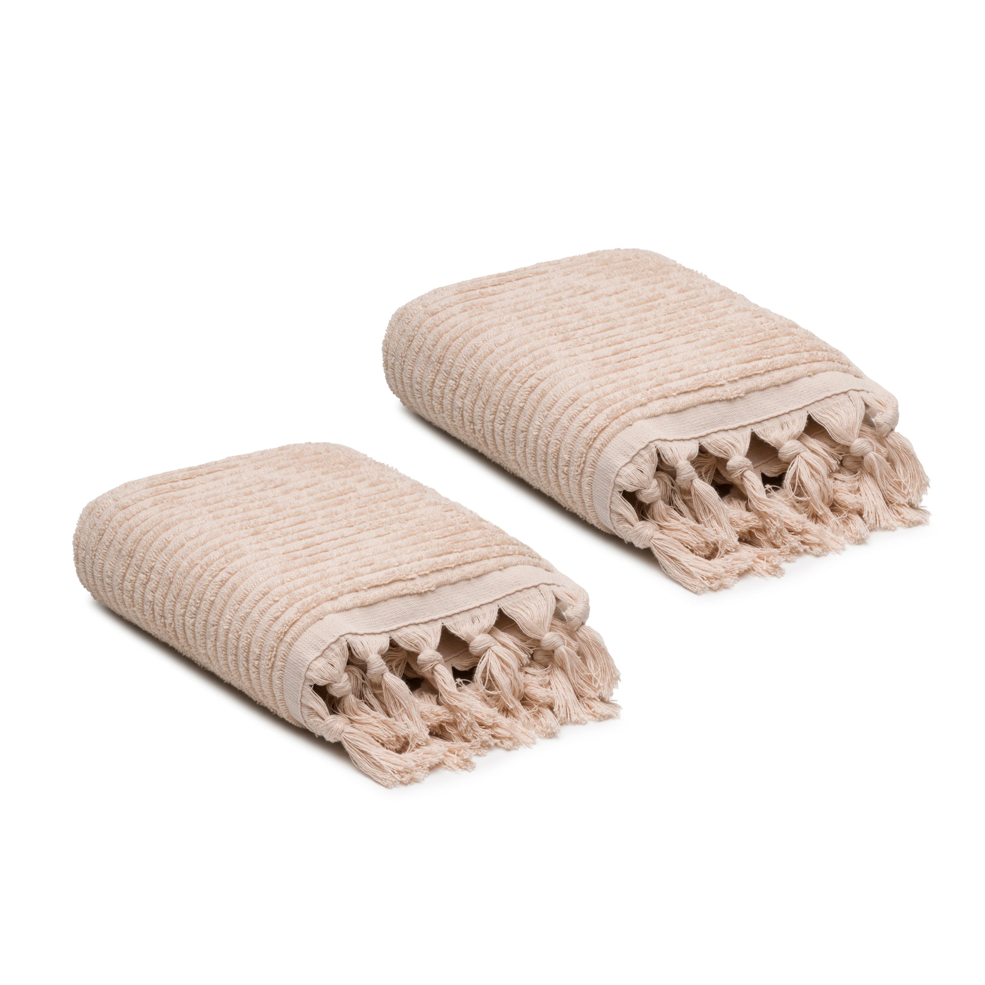 Two beige textured towels with tassels on a white background