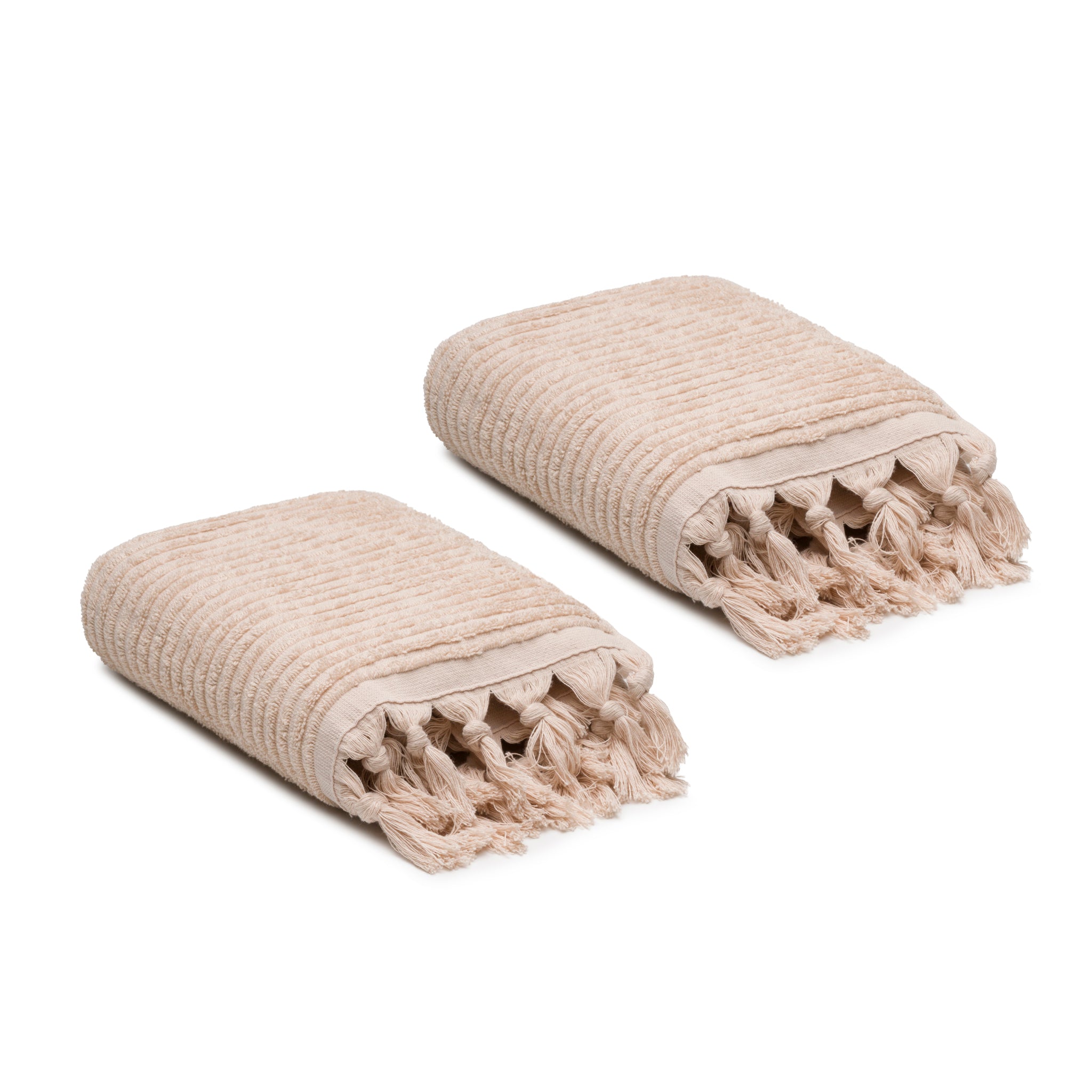 Two beige textured towels with tassels on a white background